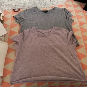 Two one gray one purple crop tops